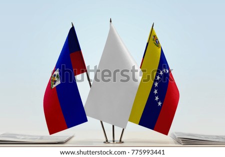Flags of Haiti and Venezuela with a white flag in the middle