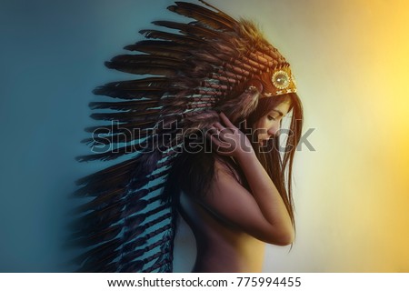beautiful girl with plume of american indian feathers