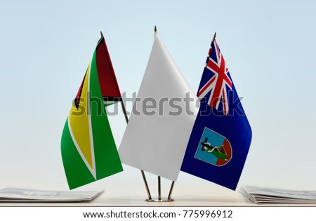 Flags of Guyana and Montserrat with a white flag in the middle