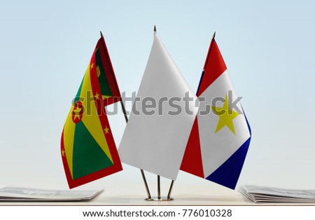 Flags of Grenada and Saba with a white flag in the middle