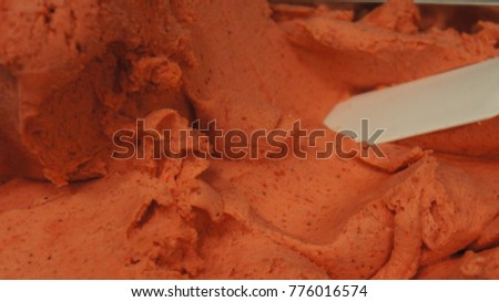 close up of a strawberry and Cream whipped or sour cream background