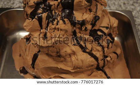 close up of a chocolate whipped or sour cream on white background