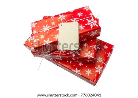 Red gift boxes with blank card for your text on a white background. Isolated