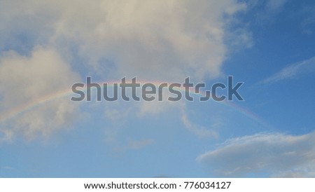 Colorful rainbow on blue sky