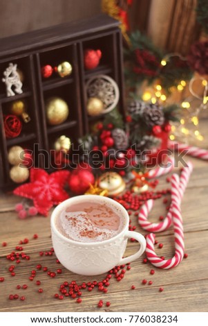 Christmas sweets, cocoa cup and decorations on wooden table. Christmas and new year holidays. festive winter season