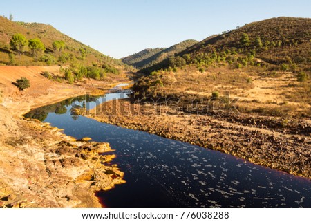 Rio Tinto river  in Huelva district, Andalusia, Spain. Amazing yellowish color of the rocks, red water.  Beautiful landscape, Area mined for copper, silver, gold, and other minerals since ancient time