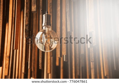 Vintage hanging Edison light bulb. Retro lighting. Beautiful retro edison light lamp decor.