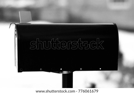 Black and White Traditional Black Mailbox Isolated Background with Room for Text and Very Shallow Depth of Field 