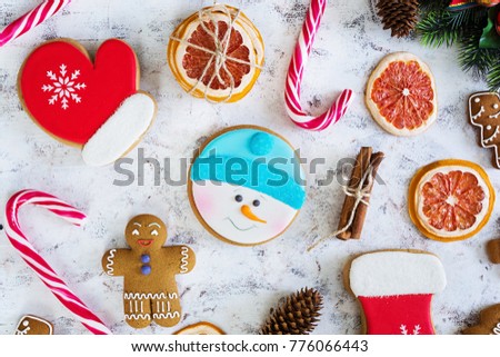 Christmas sweets, ginger cookies on wooden background. Christmas background