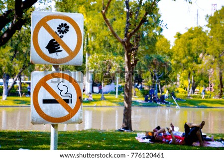 Non smoking  and Flowers sign. In public park Bangkok.Thailand. 