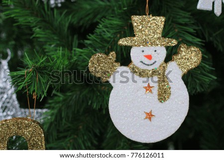 Snow cartoon decorations on christmas tree holiday festival of happy new year