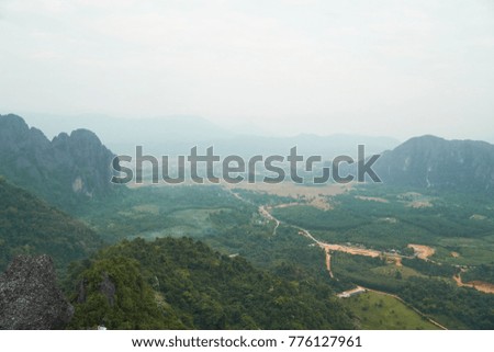 The beautiful Aerial view of Mountains in Vang Vieng City. This photo was taken in the Phou Pha ngoen or Silver Cliff.