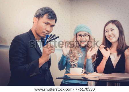Businessman holding and show credit card for pay shopping for woman.