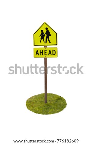 Ahead sign, people crossing, with pole and green lawn.
