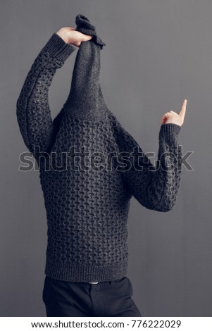 Young man freestyle wearin sweater studio concept
