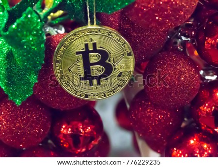Christmas decorations red glass balls and Physical metal bitcoin coin, financial concept. Digital currency Christmas concept.