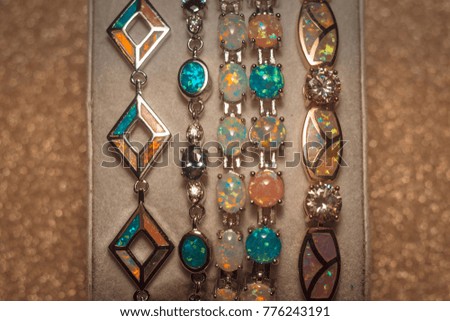Collection of fashion bracelets decorated with artificial opal stones.