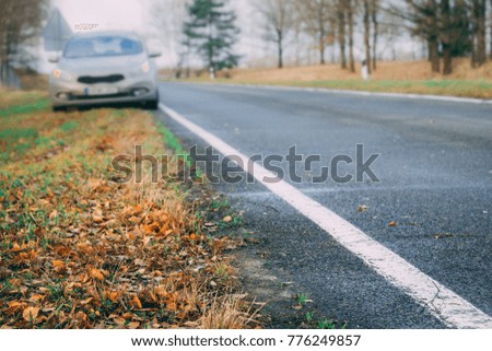 Blurry image of emergency stop. Waiting for help on the highway on warm autumn day.
Car services concept of car services.
