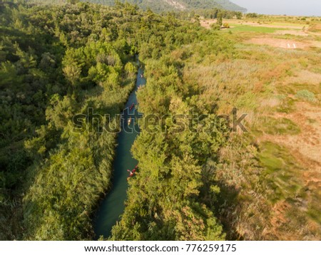 Aerial view of Sea Kayaking in the Wilderness through river in the forest