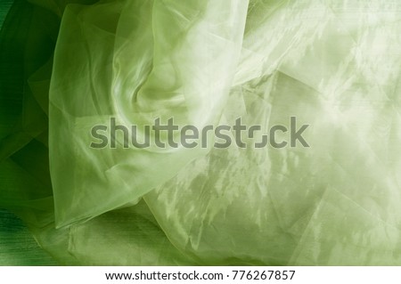 green closeup organza fabric wavy texture
