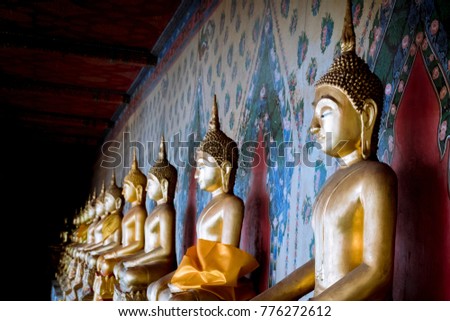 The Buddha at Wat Arun Bangkok Thailand to Buddhist or tourists pay homage.