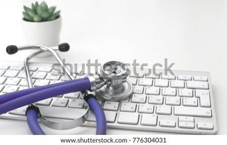 Doctor's workspace working table with patient's discharge blank paper form, medical prescription, stethoscope on desk