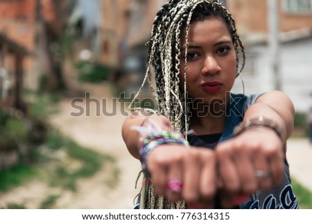 Portrait of beautiful black woman in her neighborhood. Slum Concept.