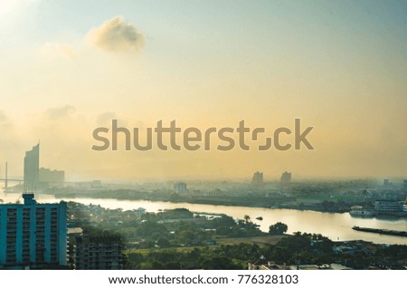 View of cityscape Chaopraya river in the morning with fog rolling in Bangkok,Thailand. 