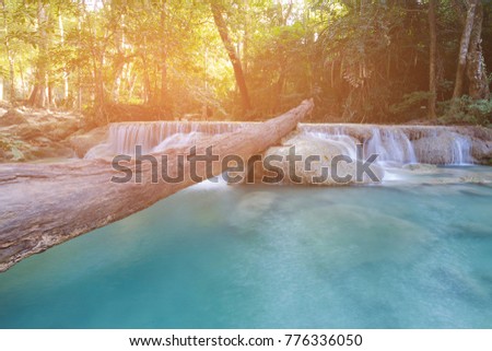 Blue stream waterfall in natural tropical forest, natural landscape background