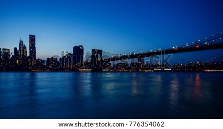 The Brooklyn Bridge and Manhattan after sunset, New York, USA, circa May 2015