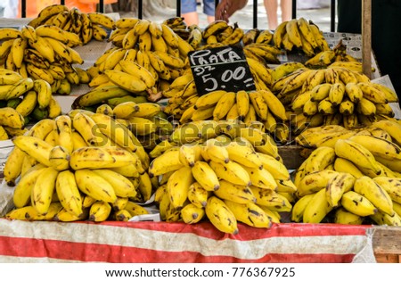 Bananas on display at a market. "Prata" written on the sign means "Silver" which is a type of small banana common in Brazil