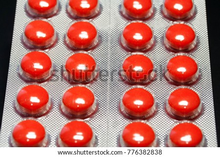 Orange tablets in the package. View from above