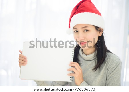 Asian woman with gift box on white background.