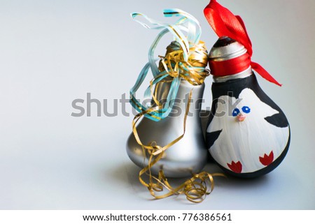 Christmas decorations. New Year's toys: penguin and pear on white background. Merry Christmas and Happy New Year.