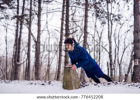 Young man working out on a winter day