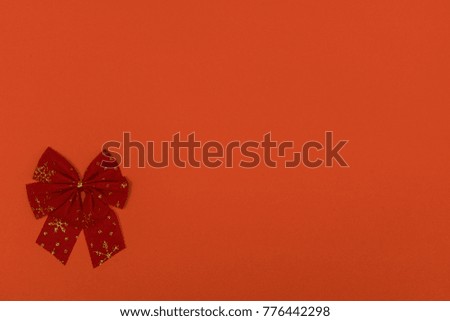 red Christmas bows on a colored background	