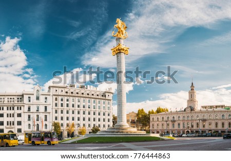 Tbilisi, Georgia. Liberty Monument Depicting St George Slaying The Dragon And Tbilisi City Hall In Freedom Square In City Center. Famous Landmark Royalty-Free Stock Photo #776444863