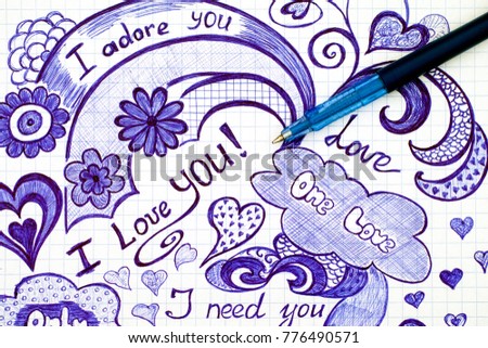 Hand drawn love doodles messages on checkered paper with ballpoint pen.