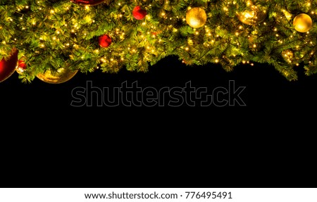 Red and gold balls hanging on christmas tree,back background.