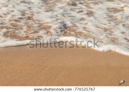 sea ripples hit the beach