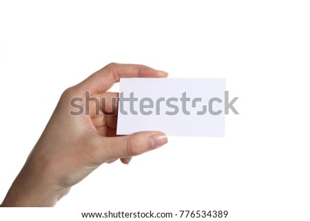 Female hand holding business card in office