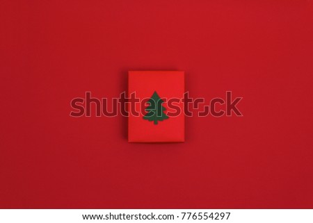 Red gift box on red background
