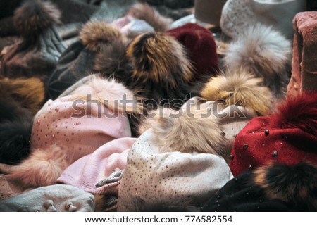 warm headwear for winter, background image of woolen hats (on the top of picture there is an ideal blurred area to insert some text)