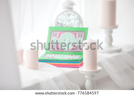 
Pink Koran - a sacred book for Muslims on a light background Royalty-Free Stock Photo #776584597