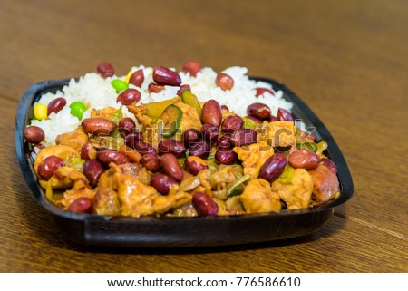 A mixture of Chinese food with rice and peanuts