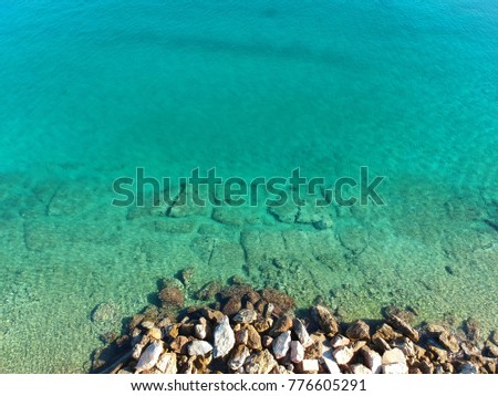 Aerial drone photo from tropical rocky seascape with turquoise clear waters in Greek island