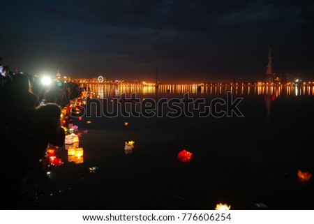 night cityscape of the capital of Udmurtia Izhevsk, Russia. An incredibly beautiful city with excellent illuminations reflecting in the lake. Christmas lights of the city on the coast