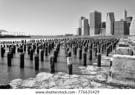 View from a pier in Dumbo of  New York City with Statue of Liberty in background