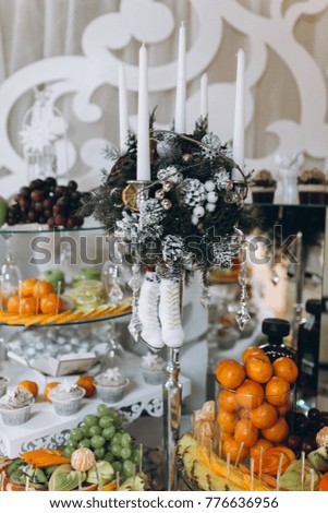 The wedding buffet is decorated in the winter theme.