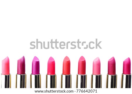multi-colored lipstick on white background